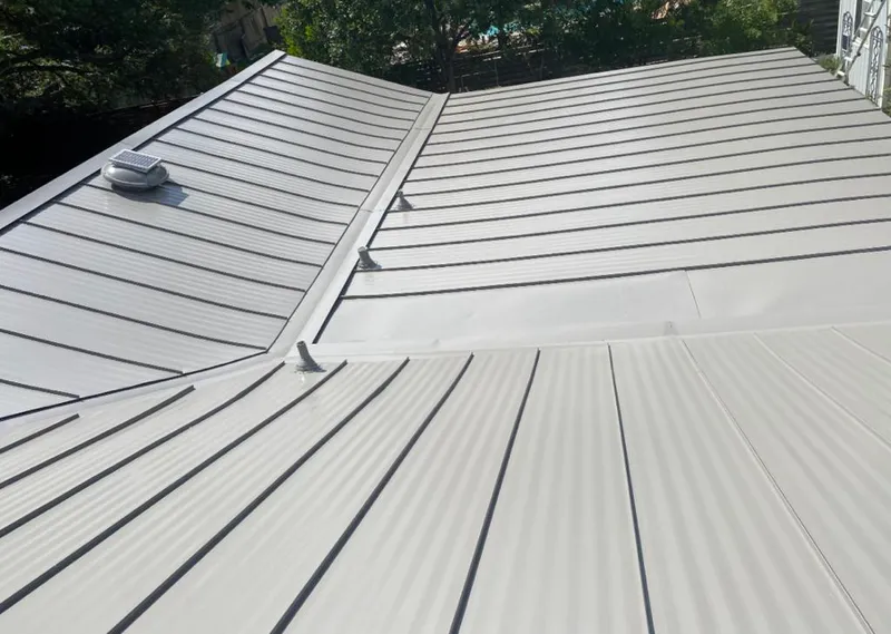 Solar attic fan installed on a metal roof for Roof Ventilation in Fruitland Park